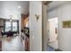 Hallway with kitchen access showcasing the transition into the dining area at 15976 W La Paloma Dr, Surprise, AZ 85374