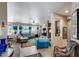 Bright living room with tile flooring, comfortable seating, and stylish décor at 15976 W La Paloma Dr, Surprise, AZ 85374