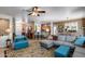 Open floor plan showcasing living room, kitchen, and dining area, great for entertaining guests at 15976 W La Paloma Dr, Surprise, AZ 85374