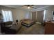 Spacious bedroom with carpet floors, ceiling fan and natural light at 16046 W Hearn Rd, Surprise, AZ 85379