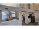Open-concept floor plan featuring neutral walls, wood flooring, and an abundance of natural light at 16046 W Hearn Rd, Surprise, AZ 85379