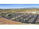 Aerial view of retail shops and a Safeway grocery store with ample parking and desert mountain views at 16389 W Fawn Dr, Goodyear, AZ 85338