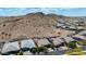 Desert homes feature tile roofs with mountain backdrop, some with solar panels on this sunny day in Estrella at 16389 W Fawn Dr, Goodyear, AZ 85338