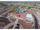 Aerial view of the community clubhouse and pool, highlighting the amenities and surrounding neighborhood at 16389 W Fawn Dr, Goodyear, AZ 85338