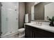 Elegant bathroom with glass-enclosed shower, vanity, and modern finishes at 16389 W Fawn Dr, Goodyear, AZ 85338