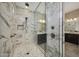 Luxurious bathroom featuring an elegant marble shower and double vanity at 16389 W Fawn Dr, Goodyear, AZ 85338