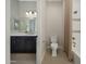 Bathroom with vanity, toilet, and shower/tub combo with shower curtain at 16389 W Fawn Dr, Goodyear, AZ 85338