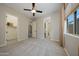 Spacious bedroom with walk-in closet and en-suite bathroom, flooded with natural light at 16389 W Fawn Dr, Goodyear, AZ 85338