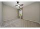 Bright, spacious bedroom with ceiling fan, plush carpet and a window with natural light at 16389 W Fawn Dr, Goodyear, AZ 85338
