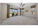 Large bedroom with a sliding glass door and great natural light at 16389 W Fawn Dr, Goodyear, AZ 85338
