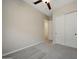 Neutral bedroom featuring a ceiling fan, carpet and closet with sliding doors at 16389 W Fawn Dr, Goodyear, AZ 85338
