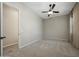 Neutral bedroom featuring a ceiling fan, plush carpet and a window with natural light at 16389 W Fawn Dr, Goodyear, AZ 85338