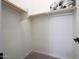 This walk-in closet features built-in shelving with ample space for storage at 16389 W Fawn Dr, Goodyear, AZ 85338