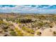 An aerial view of Estrella community center with desert landscaping, walking paths, and mountain views at 16389 W Fawn Dr, Goodyear, AZ 85338