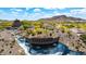 Picturesque Estrella community entrance with water features and desert landscaping creates a welcoming atmosphere at 16389 W Fawn Dr, Goodyear, AZ 85338