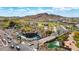Scenic aerial view of the Estrella entrance with water features, lush landscaping, and scenic desert mountain backdrop at 16389 W Fawn Dr, Goodyear, AZ 85338