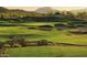 Picture of a well-maintained golf course with rolling hills and sand traps at 16389 W Fawn Dr, Goodyear, AZ 85338