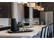 Modern kitchen featuring a white quartz countertop island, stainless steel appliances and stylish pendant lighting at 16389 W Fawn Dr, Goodyear, AZ 85338