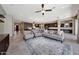 Bright and airy living area with comfortable seating and a spacious layout, with the kitchen in the background at 16389 W Fawn Dr, Goodyear, AZ 85338