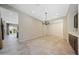 Open living space with ceramic tile flooring, recessed lights, adjacent to kitchen and backyard at 16389 W Fawn Dr, Goodyear, AZ 85338
