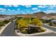 Aerial view of the community park featuring a shaded seating area, green space, and yellow trees in Estrella at 16389 W Fawn Dr, Goodyear, AZ 85338