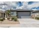 Charming single-Gathering home showcases a two-car garage and low-maintenance landscaping for easy living at 17376 W Via De Luna Dr, Surprise, AZ 85387