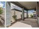 A covered patio with a concrete floor and views of the backyard at 17376 W Via De Luna Dr, Surprise, AZ 85387