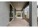 A covered patio with a concrete floor and views of the backyard at 17376 W Via De Luna Dr, Surprise, AZ 85387
