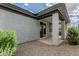 The covered patio has a sliding glass door and stone landscaping at 17376 W Via De Luna Dr, Surprise, AZ 85387
