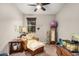 This bedroom features a lounge chair, mirror, fish tank, and is well decorated at 17419 W Georgia Dr, Surprise, AZ 85388