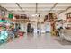 Well-organized garage space with ample storage, epoxy flooring, and various tools at 17419 W Georgia Dr, Surprise, AZ 85388