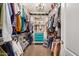 This walk-in closet offers plenty of storage and a chandelier to brighten up the space at 17419 W Georgia Dr, Surprise, AZ 85388