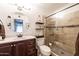 Modern bathroom featuring a tiled shower, modern fixtures, and a vanity at 17802 N 45Th Ave, Glendale, AZ 85308