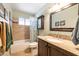 Cozy bathroom with tiled shower, granite vanity, and modern fixtures at 17802 N 45Th Ave, Glendale, AZ 85308