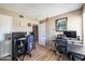 Bedroom with two desks, hardwood floors, neutral walls, and natural light at 17802 N 45Th Ave, Glendale, AZ 85308