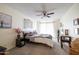 Cozy bedroom with a ceiling fan, natural light, and neutral decor at 17802 N 45Th Ave, Glendale, AZ 85308