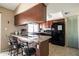 Charming kitchen with breakfast bar, stainless steel appliances, and granite countertops at 17802 N 45Th Ave, Glendale, AZ 85308