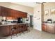 Charming kitchen with breakfast bar, stainless steel appliances, and granite countertops at 17802 N 45Th Ave, Glendale, AZ 85308