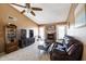 Comfortable living room featuring a fireplace, vaulted ceilings, and stylish decor at 17802 N 45Th Ave, Glendale, AZ 85308