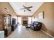 Inviting living room with vaulted ceiling, fireplace, tile flooring, and a ceiling fan at 17802 N 45Th Ave, Glendale, AZ 85308