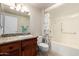 Bathroom features a shower/tub combo, granite counters, and soft lighting at 17804 N Del Webb Blvd, Sun City, AZ 85373