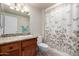 Bathroom featuring a granite countertop, decorative shower curtain, and soft lighting at 17804 N Del Webb Blvd, Sun City, AZ 85373