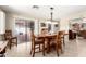 Dining room featuring sliding glass doors out to the patio with barbecue at 17804 N Del Webb Blvd, Sun City, AZ 85373