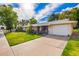 Single Gathering house with manicured lawn, mature plants, and a two-car garage at 17804 N Del Webb Blvd, Sun City, AZ 85373