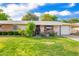 Charming single-story home with a well-maintained lawn and mature landscaping at 17804 N Del Webb Blvd, Sun City, AZ 85373
