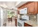 Efficient kitchen boasts sleek appliances, granite counters, and cozy breakfast space at 17804 N Del Webb Blvd, Sun City, AZ 85373
