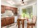 Inviting kitchen featuring wood cabinetry, granite countertops, and breakfast nook at 17804 N Del Webb Blvd, Sun City, AZ 85373