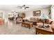 Spacious living room featuring tile floors, ceiling fan and neutral color palette at 17804 N Del Webb Blvd, Sun City, AZ 85373