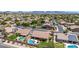 Well-maintained home features a refreshing freeform pool, covered patio, and ample lounging space with desert landscape at 17836 N 52Nd Pl, Scottsdale, AZ 85254