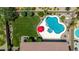 Inviting backyard includes a freeform pool with desert landscaping and a well-manicured green lawn at 17836 N 52Nd Pl, Scottsdale, AZ 85254